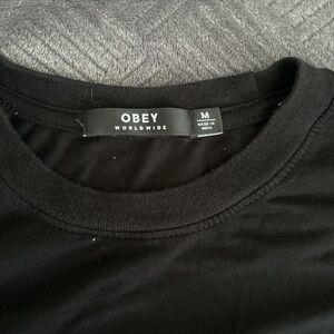 Black Obey baggy T shirt with elastic waist. Size M